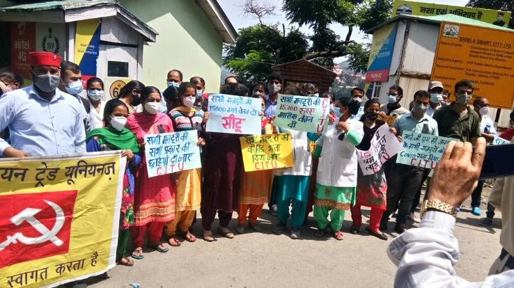 Shimla: CITU State Committee staged a silent protest outside IGMC
