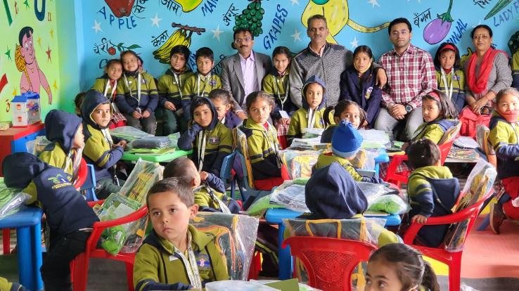 School dress, blazer and track suit distributed to school children