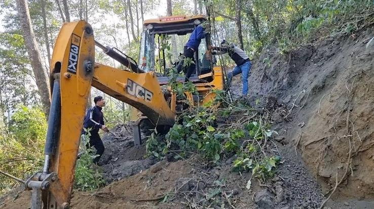 The mountain fell on the JCB cutting the road