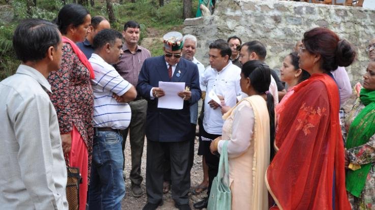 Dr. Shandil inspected the landslide area caused by rain in Badlyana village of Anji.