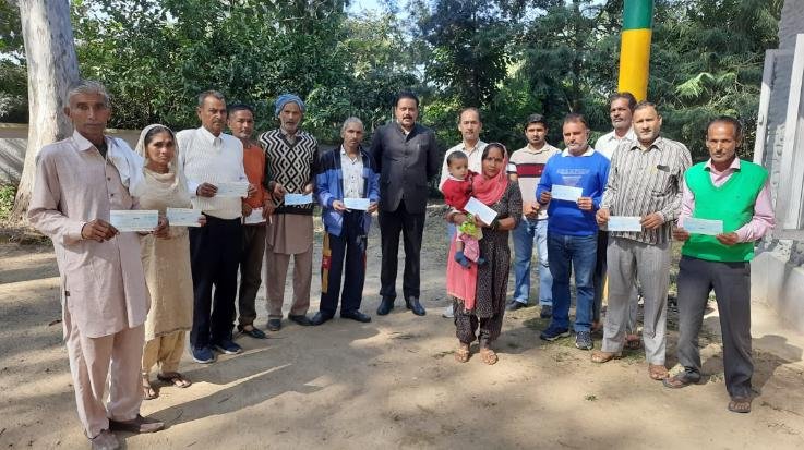 MLA Malendra Rajan distributed checks worth Rs 6.70 lakh to 14 eligible people.