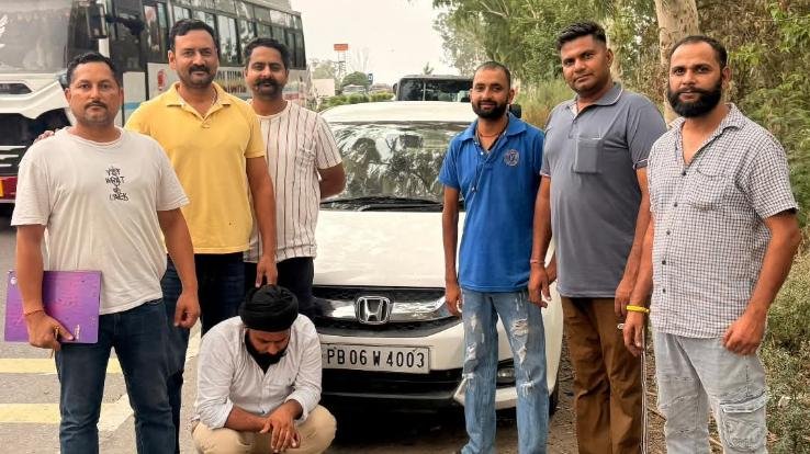Police team with arrested drug smuggler and car