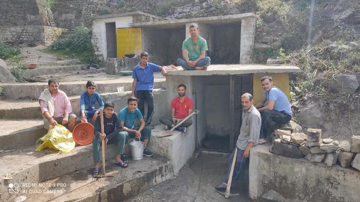Villagers of Kund village clean water sources and roads
