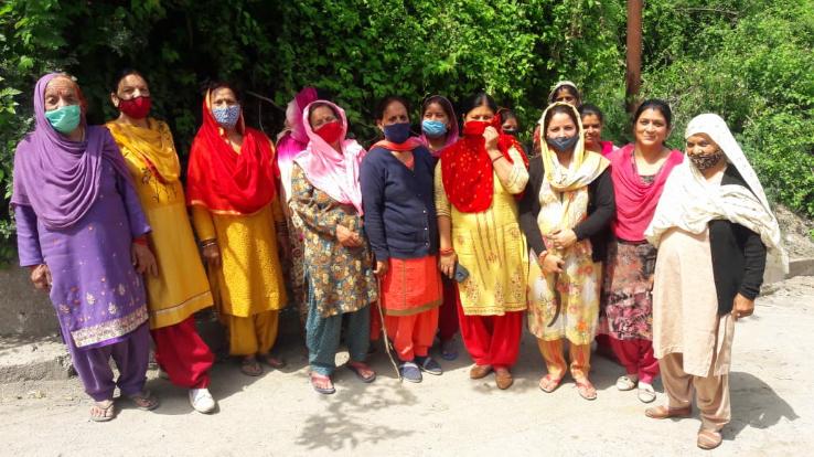 Women cleaning water resources in Hatkot Panchayat
