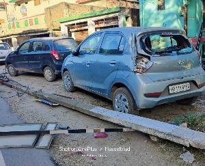 Car damaged due to fall of electric pole