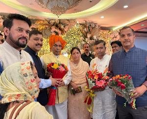 Suresh Kashyap congratulates Prof Prem Kumar Dhumal on his 50th anniversary