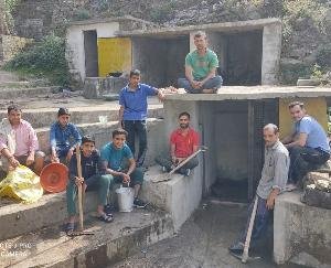 Villagers of Kund village clean water sources and roads