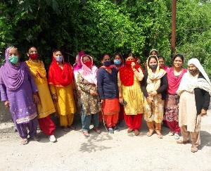 Women cleaning water resources in Hatkot Panchayat